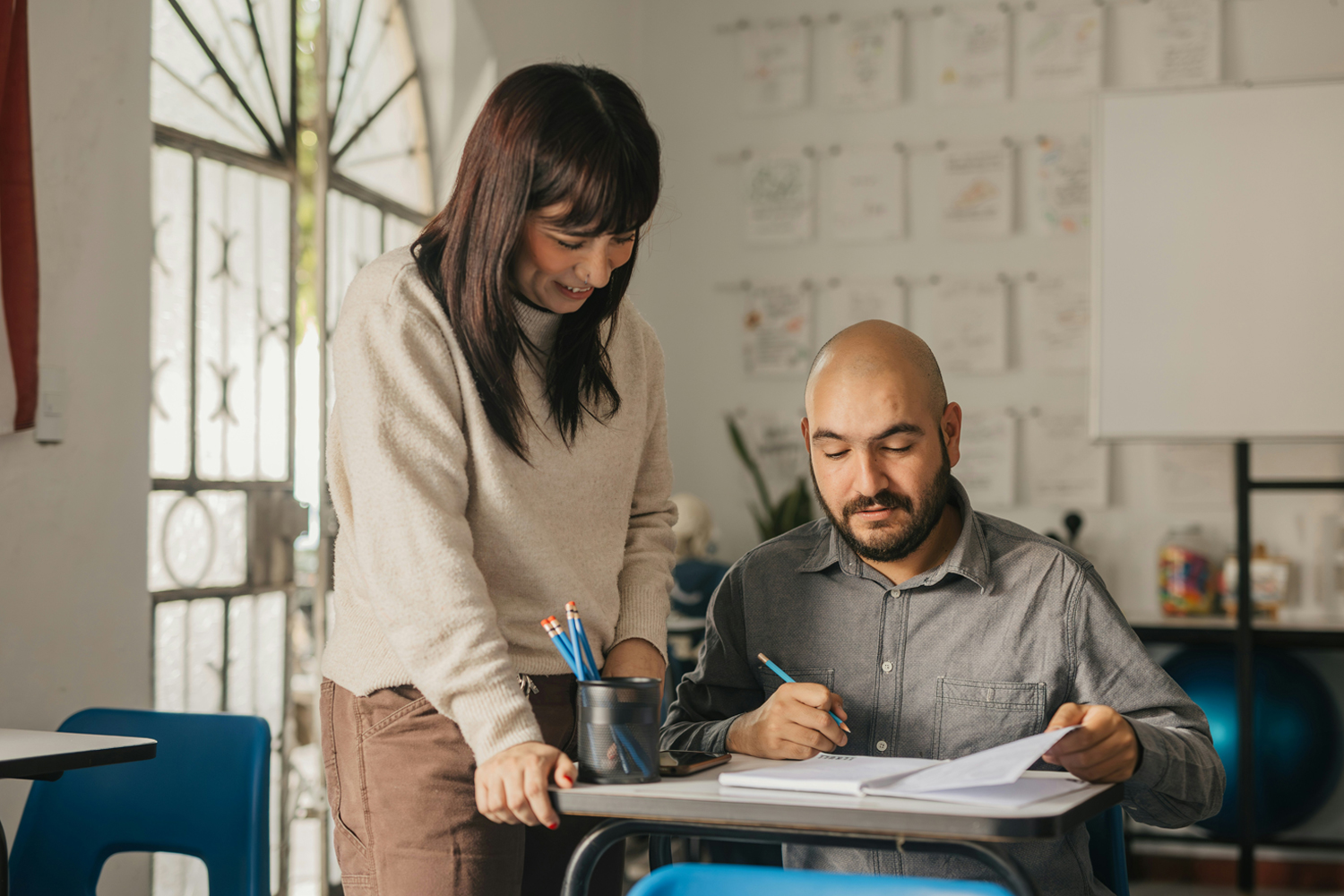 Student and teacher at an English group class with Learn English at Home