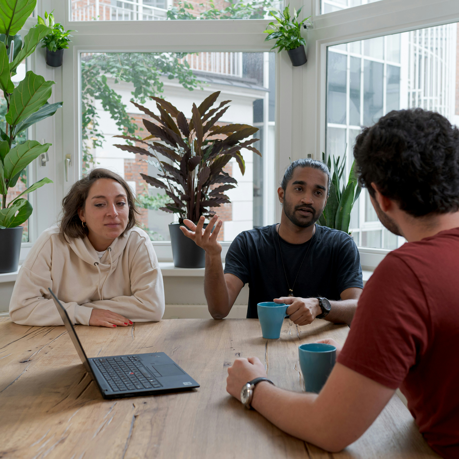 Three people having English tuition from their home in Hounslow, London