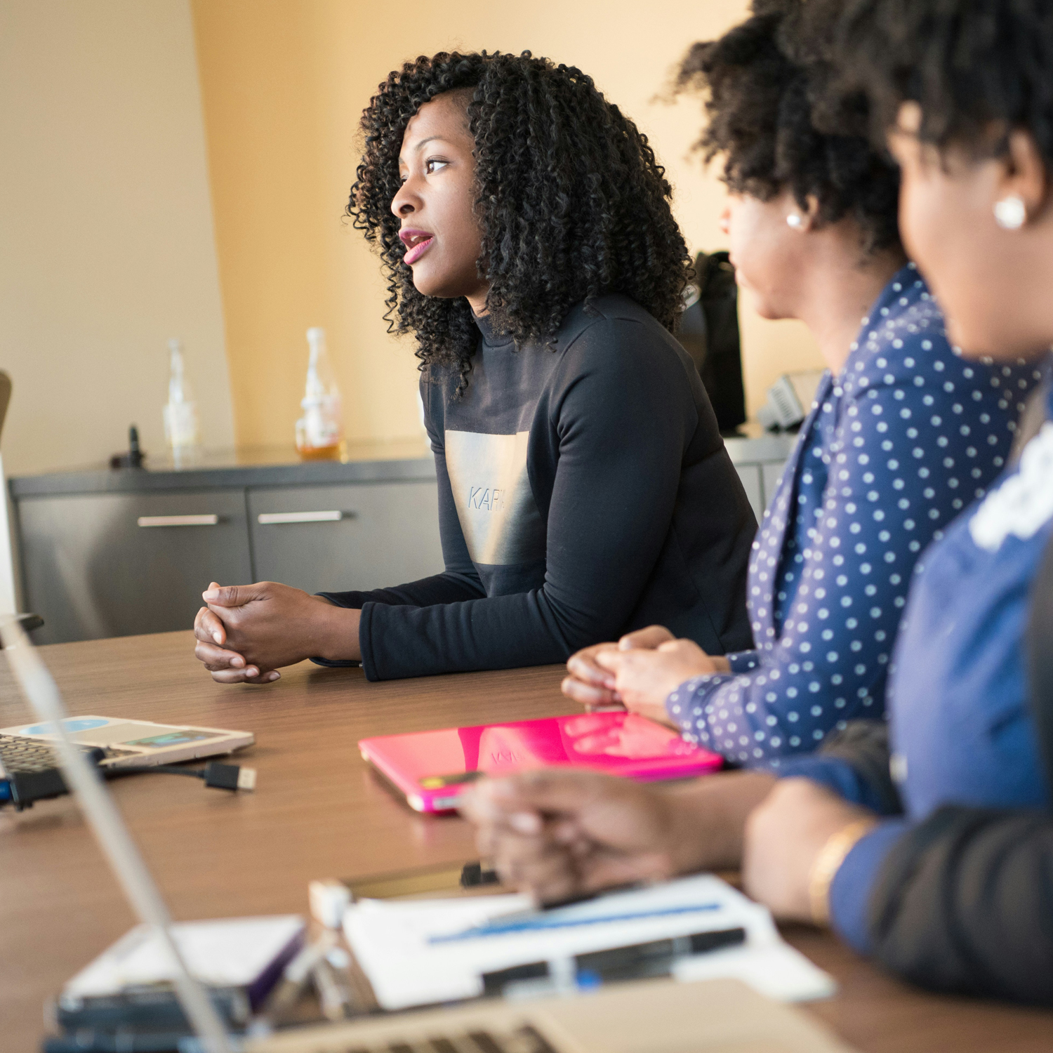 Three women at a Learn English at Home group class